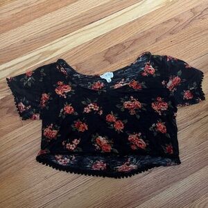 Black flowy slightly sheer top with red flowers and black lace trim